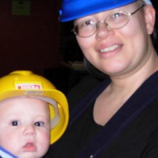 Linda-Cristal Young, Staff Electrician, Yale Repertory Theatre. On-site, baby is "Trying to be like mommy!"